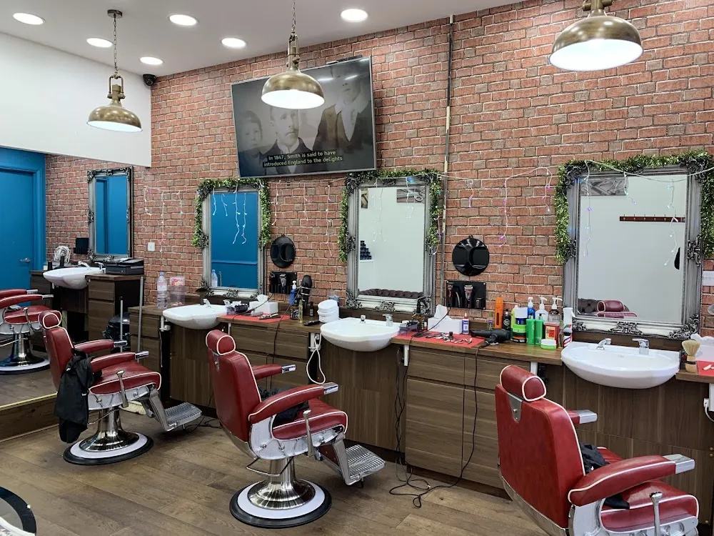 Inside the shop: brick walls and red chairs